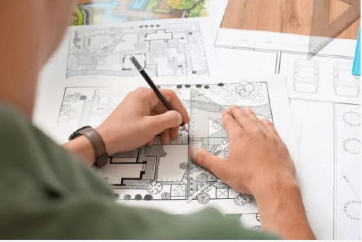 Draftsman drawing architectural diagrams.