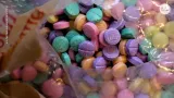 A bag of brightly colored pills.