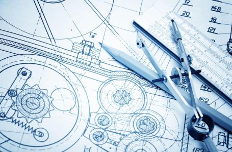 Blueprints with drafting tools.